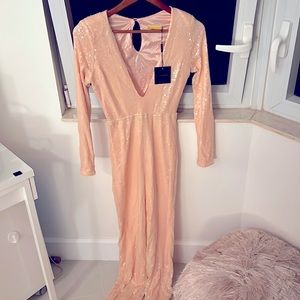 Pink jumpsuit shoulder pads